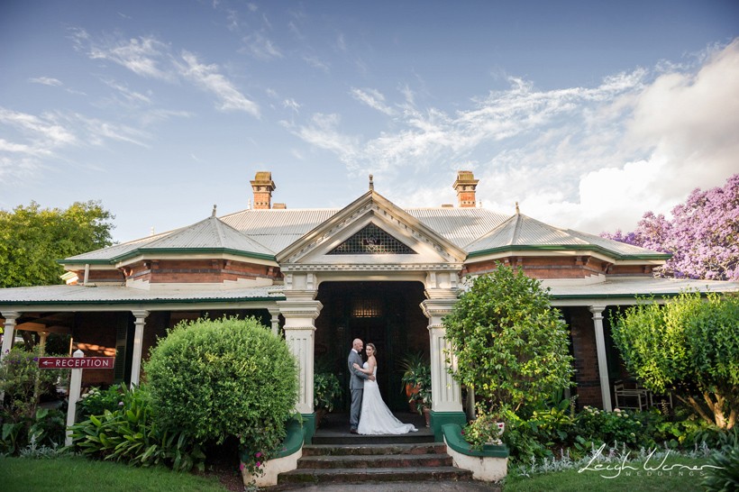 Bride and Groom in front of historic house in Toowoomba